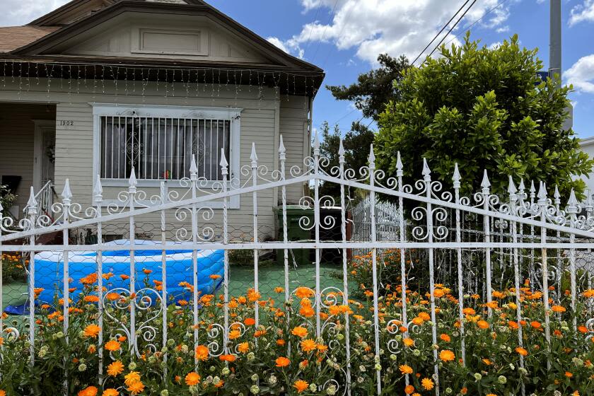 Column: Fences in Los Angeles have gotten taller, gone horizontal, redefining neighborhood life