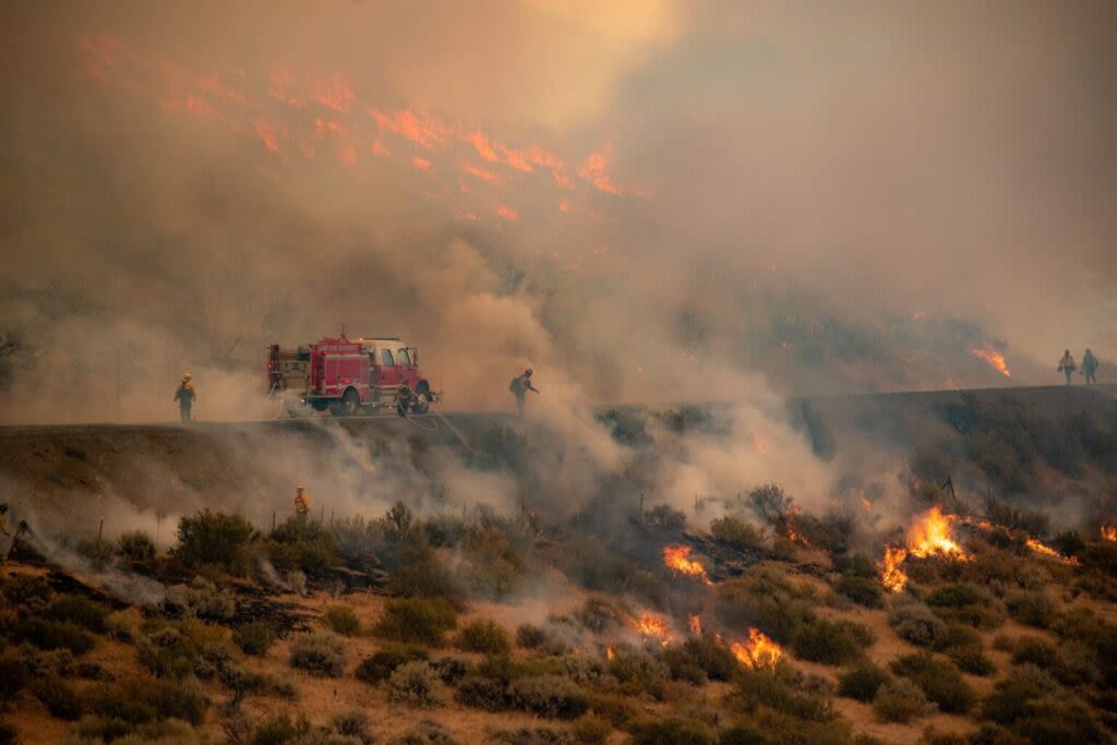 Firefighters battle 25 large wildfires in Oregon as record season blazes on