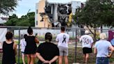 ‘A symbol of failure’: Demolition of Parkland high school massacre site begins as families of the victims look on