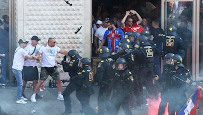 Watch: Serbia fans chant Vladimir Putin’s name amid violent clashes with German police