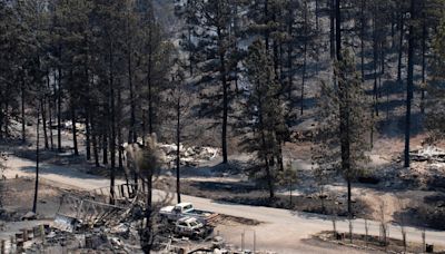 Firefighters battling fierce New Mexico wildfires may get help from Mother Nature, but rain could pose flood risk