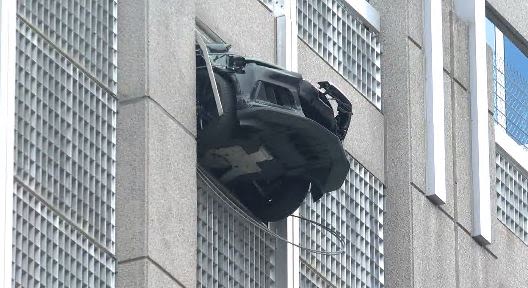 Car dangling from uptown Charlotte parking deck