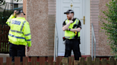 Woman dies at Glasgow house as cops lock down scene & man arrested for 'attack'