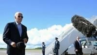 US President Joe Biden walks to speak with the press before boarding Air Force One prior to departure from Dane County Regional Airport in Madison