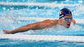 Marchand wins gold, sets record in 200M butterfly