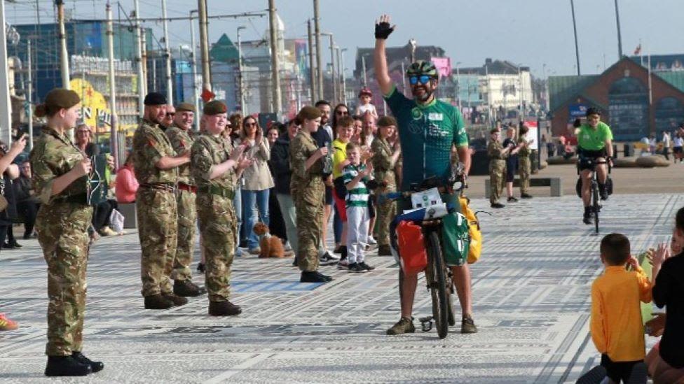 Hunted star completes 'ultimate eco-triathlon'