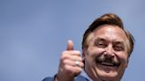 Mike Lindell went to Florida to distribute 12,000 pillows for hurricane relief and promoted his products in front of a wrecked home