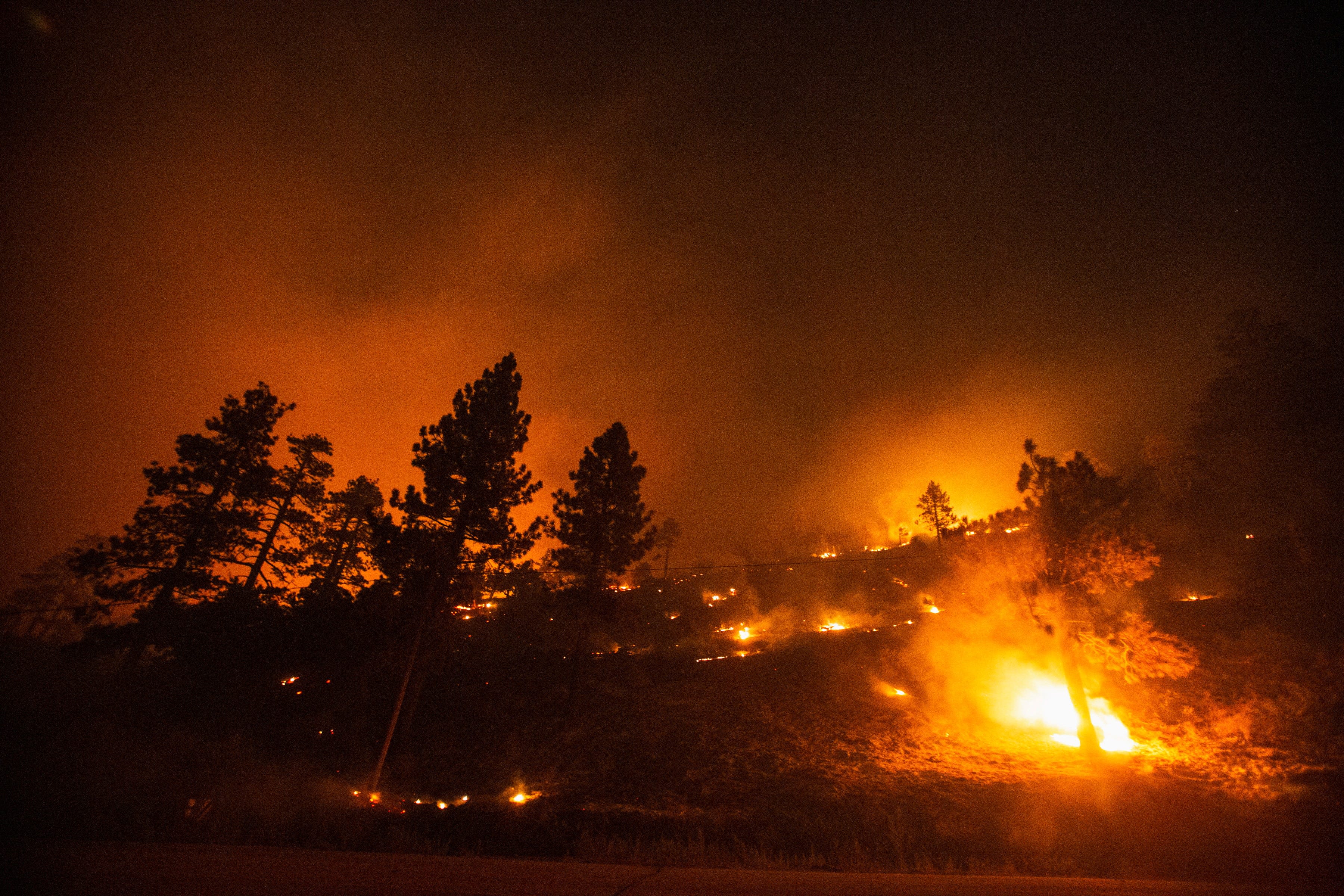 Bridge Fire explodes in size, prompts evacuations and burns homes in SoCal