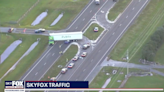 Car gets wedged under semi making U-turn on Florida highway, cops say. Driver killed