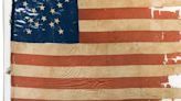 A 19th century flag disrupts leadership at an Illinois museum and prompts a state investigation