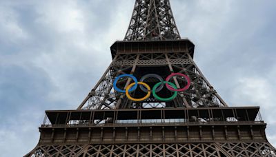 Eiffel Tower evacuated as man seen climbing it hours before Olympics ceremony