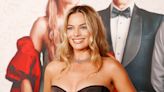 Margot Robbie Is the Antithesis of Barbie in a Black Corset and Unbuttoned Trousers