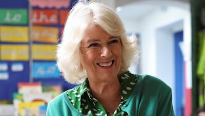 Adorable moment Camilla listens to children singing at school