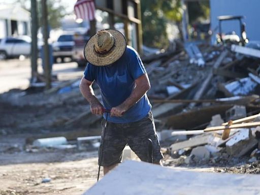 Supplies rushed to communities isolated by Helene as death toll rises to at least 107