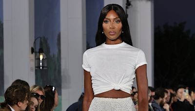 Naomi Campbell flashes her toned abs in beaded skirt