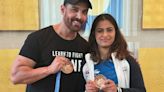 John Abraham meets Olympic medalist Manu Bhaker; netizens don't like him touching her medal