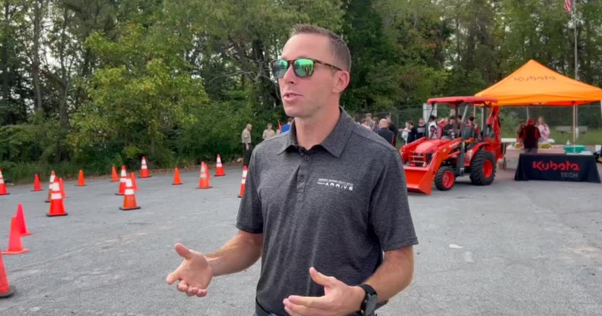 NASCAR driver Ryan Chastain gives driving safety tips to high school students