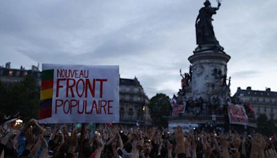 In pictures: Jubilant crowds celebrate French election results in Paris