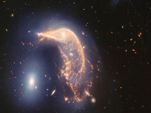 Webb Space Telescope’s latest cosmic shot shows pair of intertwined galaxies glowing in infrared