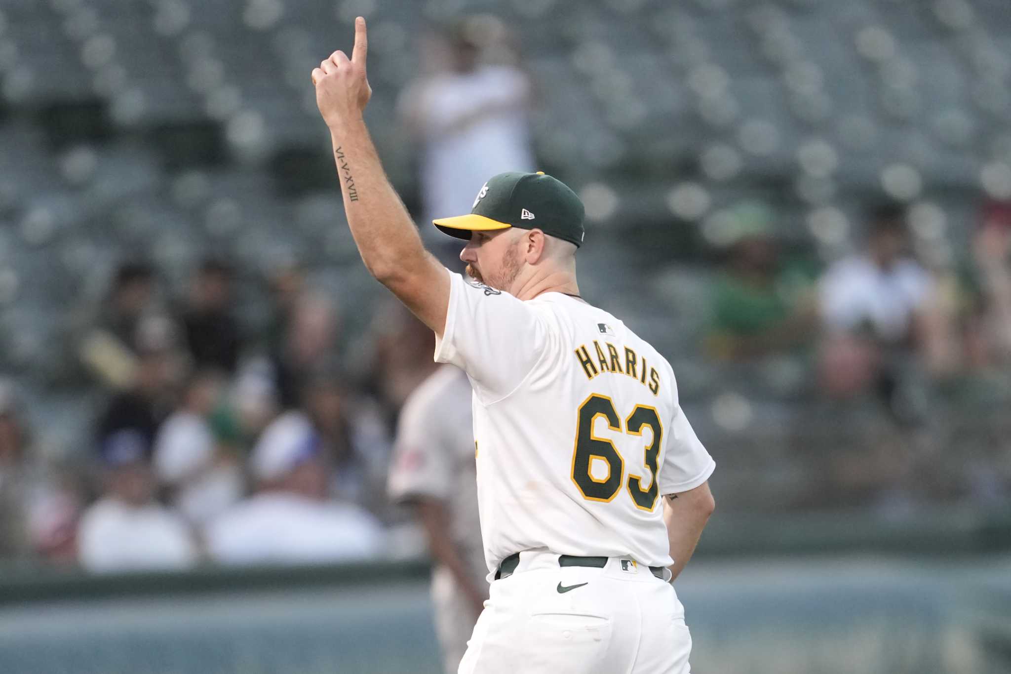 Hogan Harris and 3 Athletics relievers combine to blank Astros 4-0