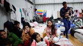 Uprooted by Brazil floods, foreign refugees 'start all over again'