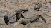 In Pictures: Mud glorious mud! Competitors raise charity cash in annual mud race
