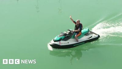 Lib Dem leader Ed Davey arrives at conference by jet ski