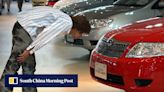 Japan’s car safety scandal deepens, as Toyota halts sale of 3 car models