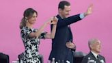 Syria's Bashar al Assad and wife laugh and wave at Asian Games opening ceremony amid China talks