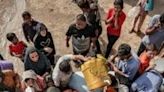 Palestinians collect water in Deir el-Balah in central Gaza, which has seen severe shortages during the war