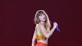 Taylor Shows Wears Kansas City Chiefs Colors at Paris Concert With Travis Kelce Watching