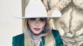 Madonna celebrates son Rocco's art exhibition in green suit and cowboy hat