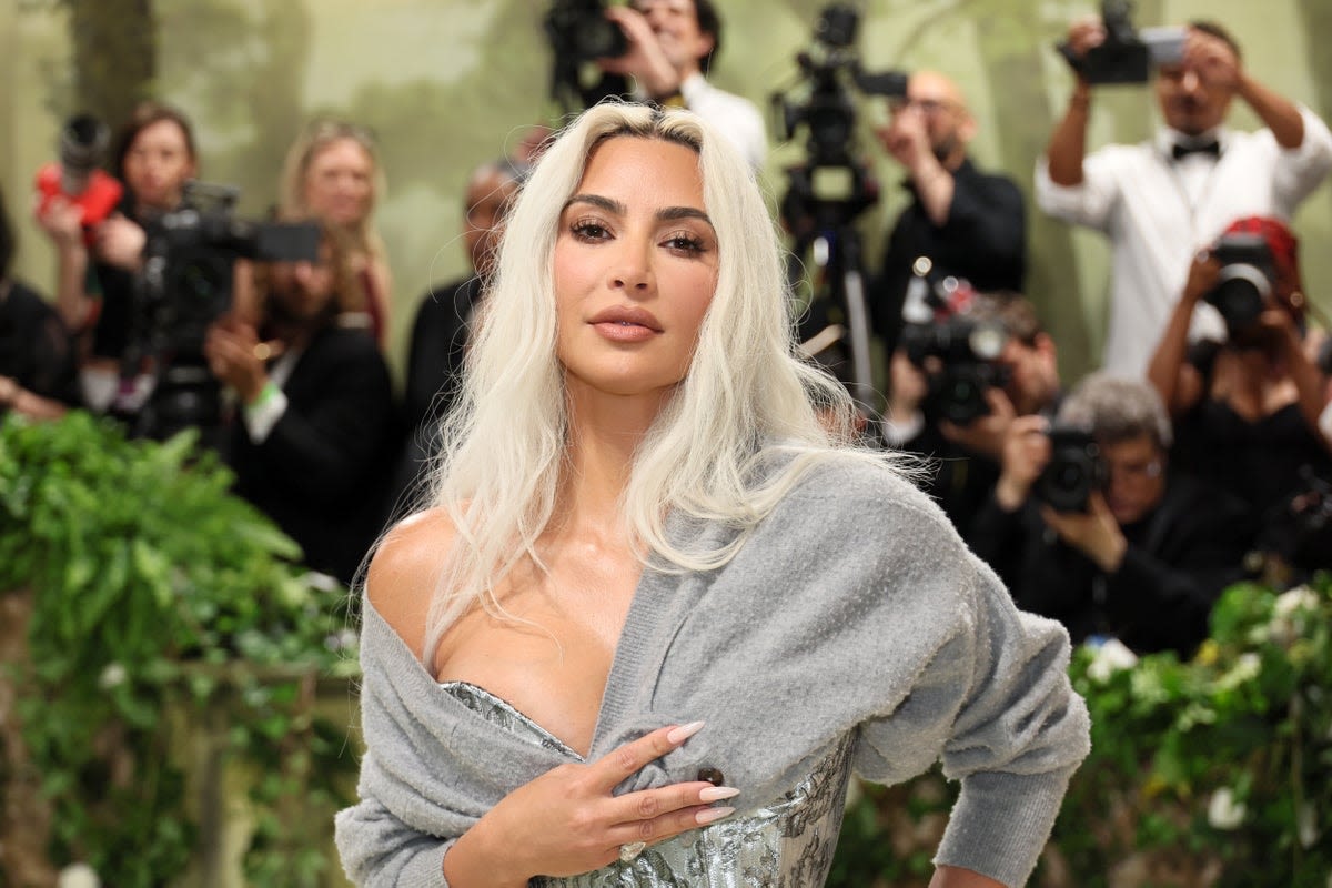 Kim Kardashian confuses fans after wearing grey cardigan on Met Gala red carpet