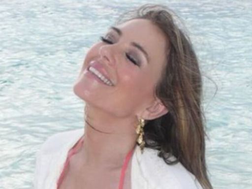 Liz Hurley flashes flesh in beach bikini pic despite 'covering up' on red carpet