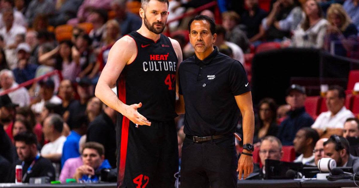 Miami Heat forward Kevin Love speaks with head coach Erik Spoelstra during the second half at Kaseya Center in Miami on Thursday, April 4, 2024.