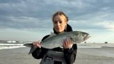 NJ fishermen catch striped bass and bluefish in the rain, wind