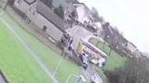 Empty school bus loses control on ice and crashes into parked cars