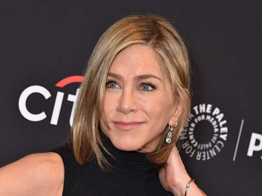 Jennifer Aniston Snuggles With Her Dog in Rare Photo Dump That Has Fans Calling for More