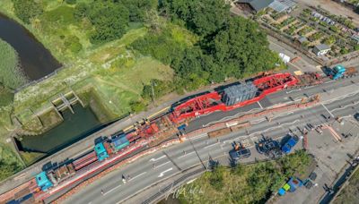 Aerial photographs show abnormal load passing through town