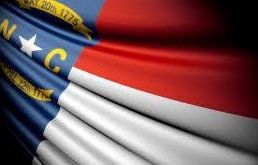 Why are flags flying at half-staff in North Carolina?