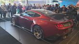 Ford Performance global director Mark Rushbrook, left, introduced the Ford Mustang GTD to French fans in the Le Mans Ford display.