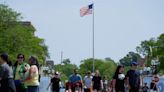 Thousands join walk in Highland Park, year after Fourth of July parade mass shooting