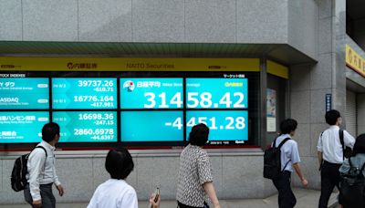 Global stock markets are sliding as Japan suffers biggest fall since 1987