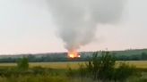 Ukrainian drone assault sets Russian munitions depot on fire