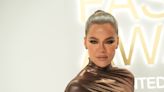 Khloé Kardashian sports dark ombré roots, complete with very 2008 face-framing layers