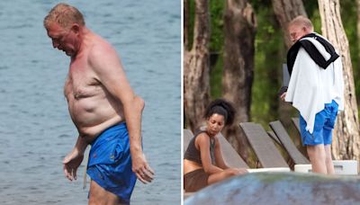 Becker shows elbow injury as he hits beach with fiancee 23 years his junior