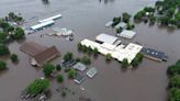Midwest flooding: At least 2 dead as heavy rains collapse a bridge, threaten a dam and trigger evacuations