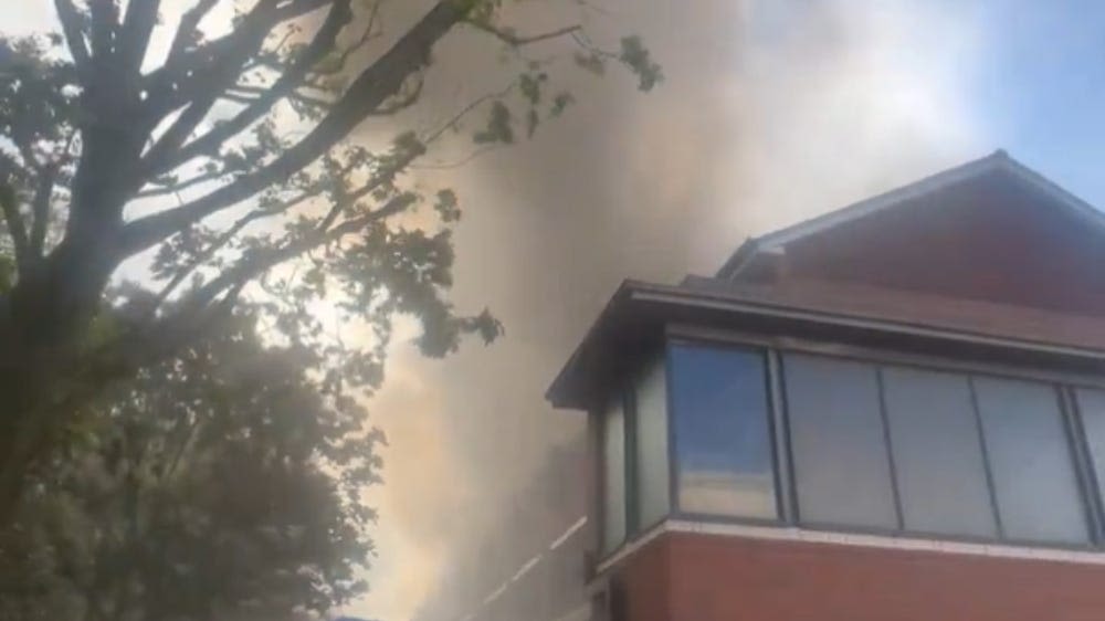 Hackney residents told to stay indoors as smoke billows from flat fire