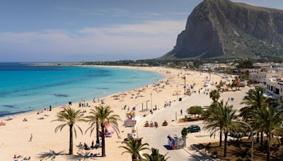 Pretty European beach compared to Rio de Janeiro with huge mountain & soft sands