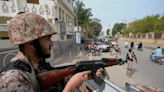 At least 29 dead in twin blasts at Pakistan political offices on eve of election